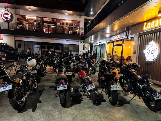 RBL motorcycles parked outside during a nighttime Tambike